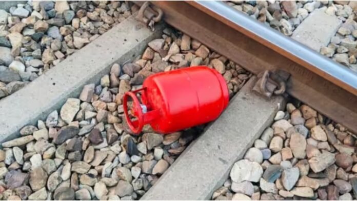 A gas cylinder on railway tracks